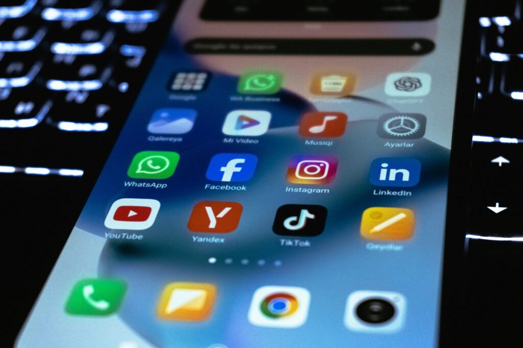 Close-up of a smartphone screen showing popular social media and utility app icons.